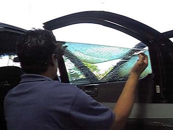 Installing a roll up window's tint
